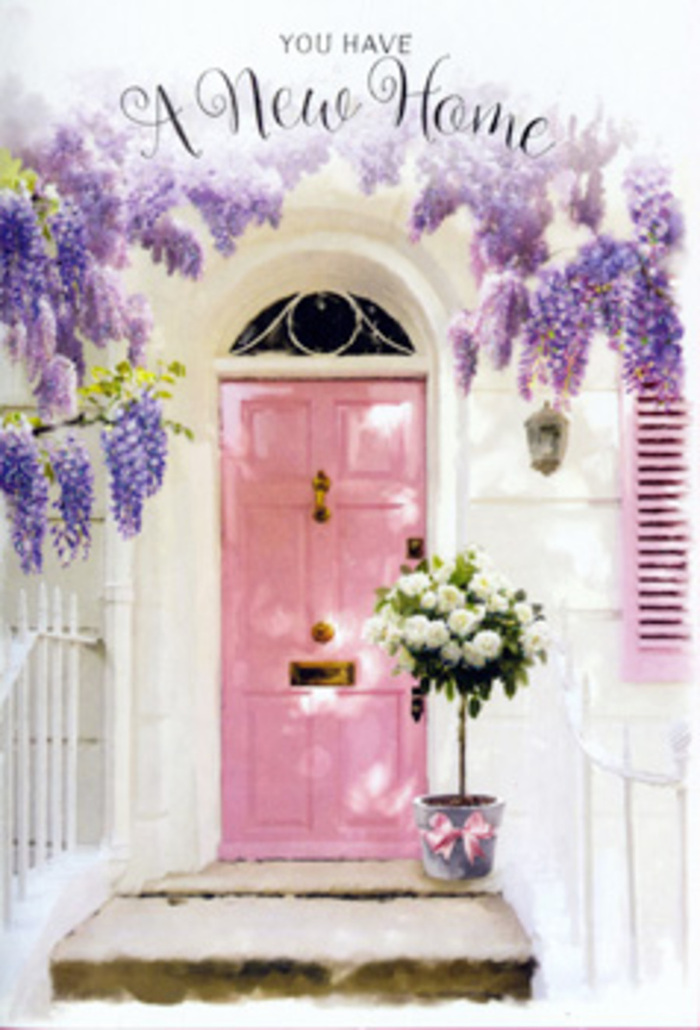A serene front step in Fitzrovia is dressed as though ready for a heartfelt housewarming, blending the charm of a side street off Tottenham Court Road with the softness of a romantic painting. The focal point is a pale pink front door, its surface smooth yet gently lived-in, exuding a cosy, welcoming spirit. To one side, a matching shutter repeats that delicate blush tone, while the surrounding wall is whitewashed and bright, its plaster catching the daylight in subtle ripples. Above, luscious wisteria pours down in sweeping trails, each stem dotted with lavender and lilac florets that hang like tiny bells, forming cascading curtains of bloom that frame the door in natural abundance. Nestled at the threshold on the step is a stylish tin or metal bucket in a soft grey hue, brimming with florist-arranged white and creamy roses. The roses are full, rounded, and velvety, layered with precision yet still relaxed, accented by sprigs of soft green foliage that add a gentle, garden-fresh feel, reminiscent of nearby Fitzroy Square gardens in early May. Around the base of the bucket, a satin pink ribbon is tied with an easy, elegant bow, echoing both the door and the soft tones of the wisteria while grounding the arrangement in pastel harmony. Light slips through the trailing blossoms, creating delicate, shifting shadows along the doorstep and highlighting the roses' creamy petals. The atmosphere is quiet and intimate, like a private celebration of new keys, new stories, and new memories in a Fitzrovia home. It feels like a moment captured just after a same-day flower delivery has been placed carefully at the door, ready to whisper, welcome home.